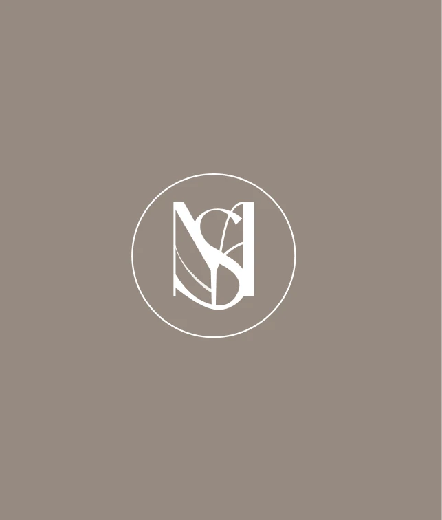 The MYSA monogram - an interlocking M and S inside a circle - in white on a warm taupe field