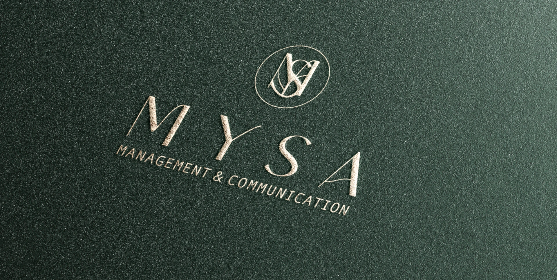 The MYSA wordmark and monogram in pale relief on deep-green textured paper